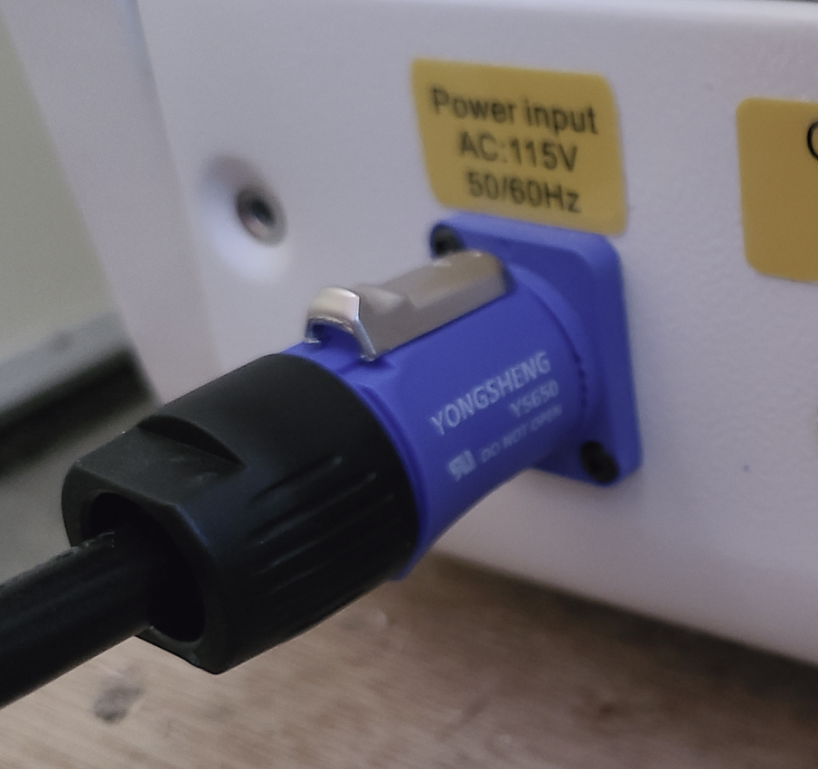 Blue plug on back of machine