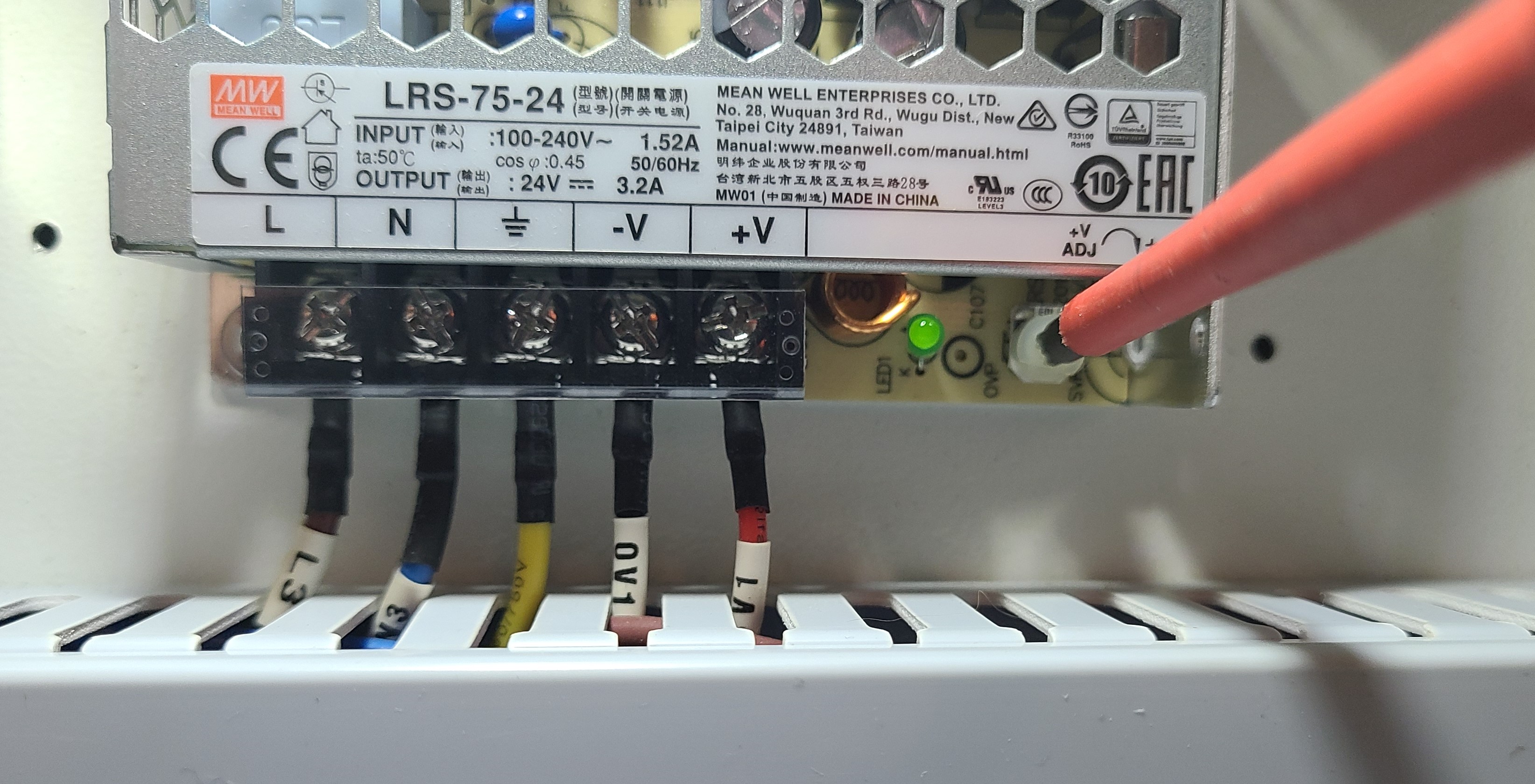 Adjusting the trim pot on the 24V power supply