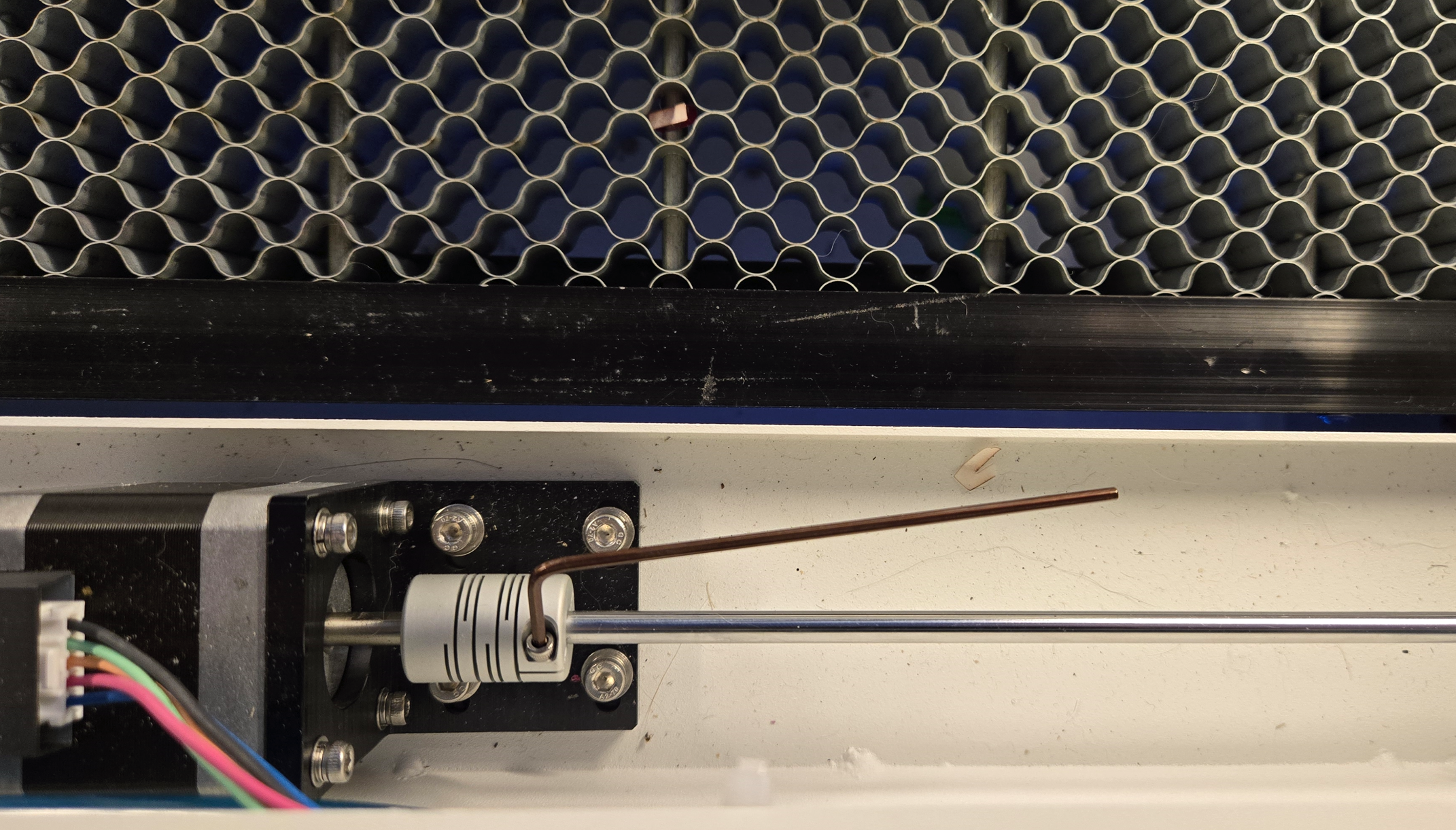 Loosening the right side coupler with 2mm Allen wrench